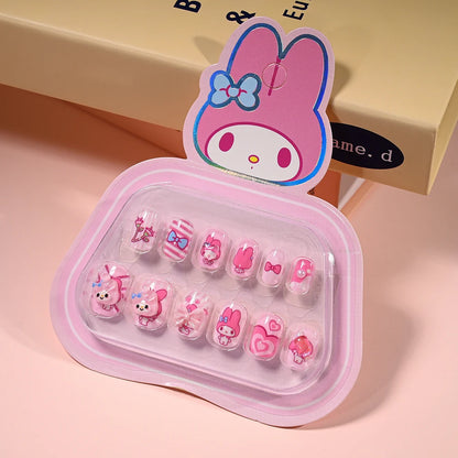 Set of pink nail art designs in a clear case with a cartoon character on top, on a pink background.