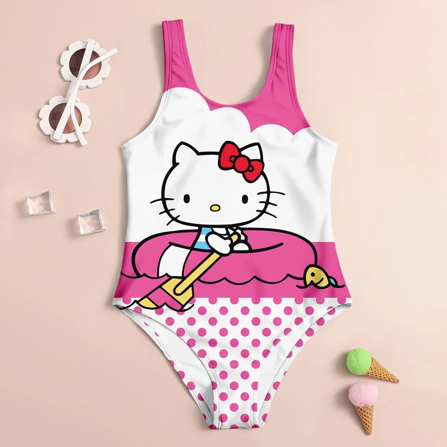 Children's swimsuit with Hello Kitty design on a beige background