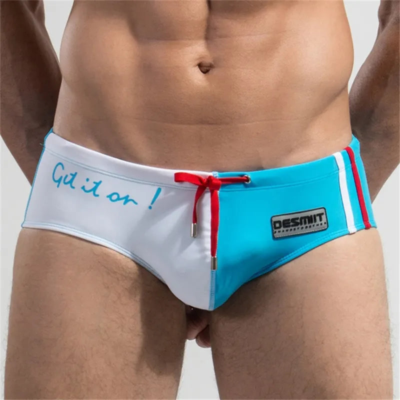 Blue and white men's underwear with red drawstring and 'Desmit' branding on a plain background.