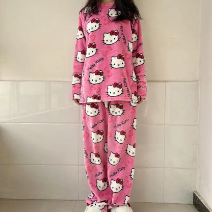 Pink 'Hello Kitty' pajama set worn by a person against a tiled wall.