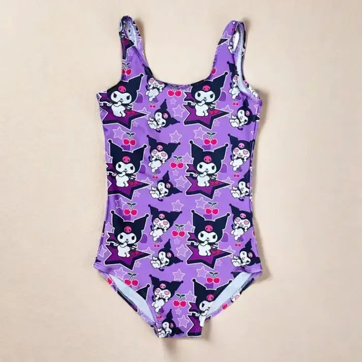 Purple swimsuit with cartoon character pattern on a beige background