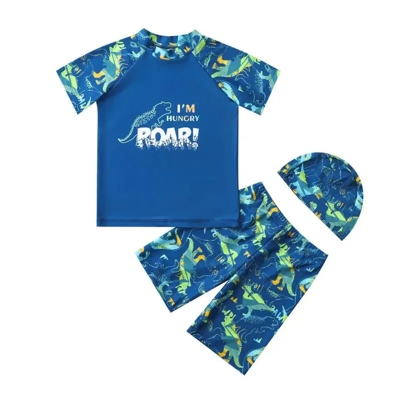 Children's dinosaur-themed swimsuit set with hat on a white background