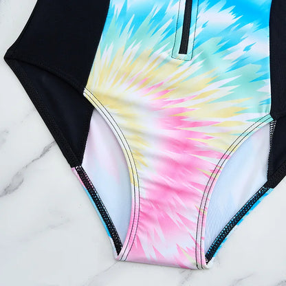 Multicolored tie-dye swimsuit on a marble surface