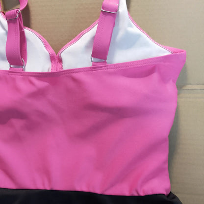 Pink and white bikini top on a cardboard background