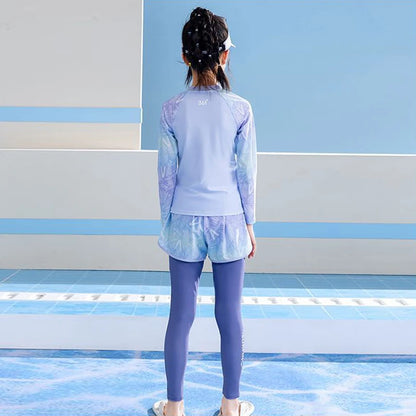 Person wearing a light blue athletic outfit standing on a blue and white striped floor.