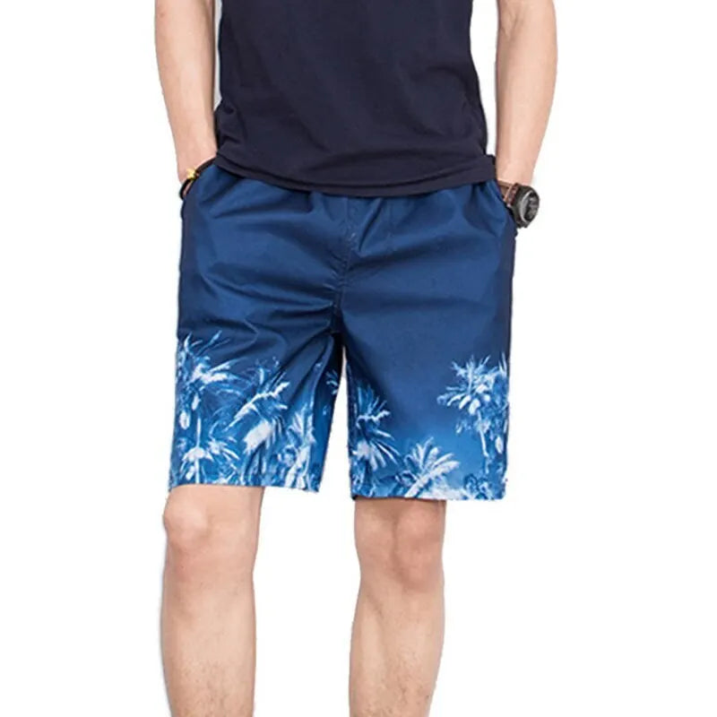 Person wearing blue shorts with a palm tree pattern on a white background
