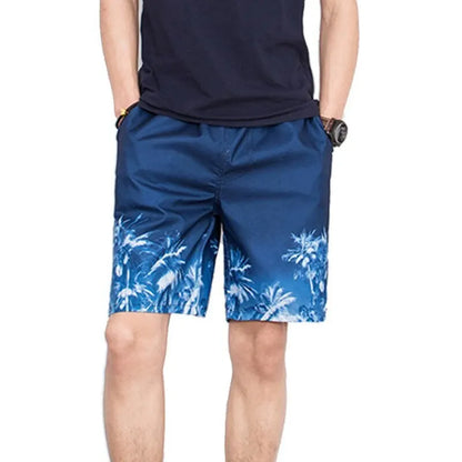 Person wearing blue shorts with a palm tree pattern on a white background