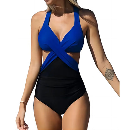 Woman wearing a blue and black swimsuit on a white background