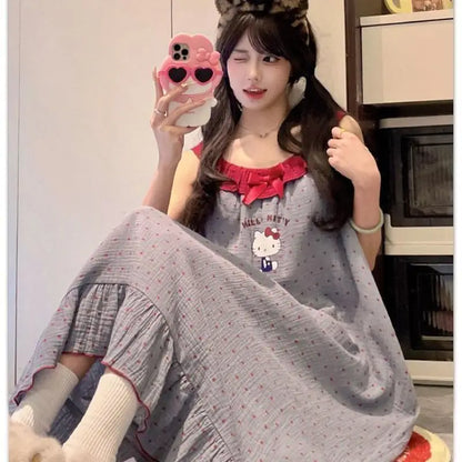 Woman wearing a Hello Kitty dress holding a phone with a matching case.