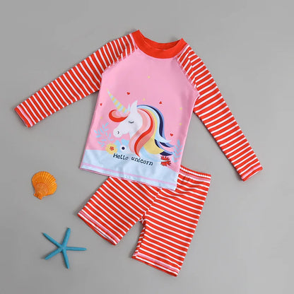 Children's swimsuit set with unicorn design on a gray background