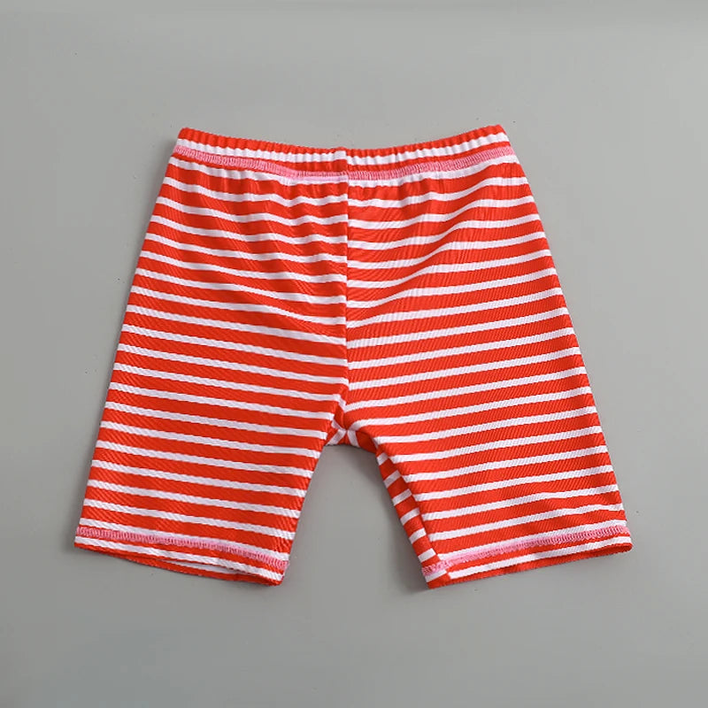 Red and white striped shorts on a gray background