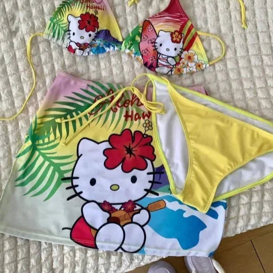 Colorful children's swimwear set with cartoon character on a textured surface.