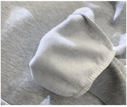 Close-up of a gray fabric with a white border on a textured surface
