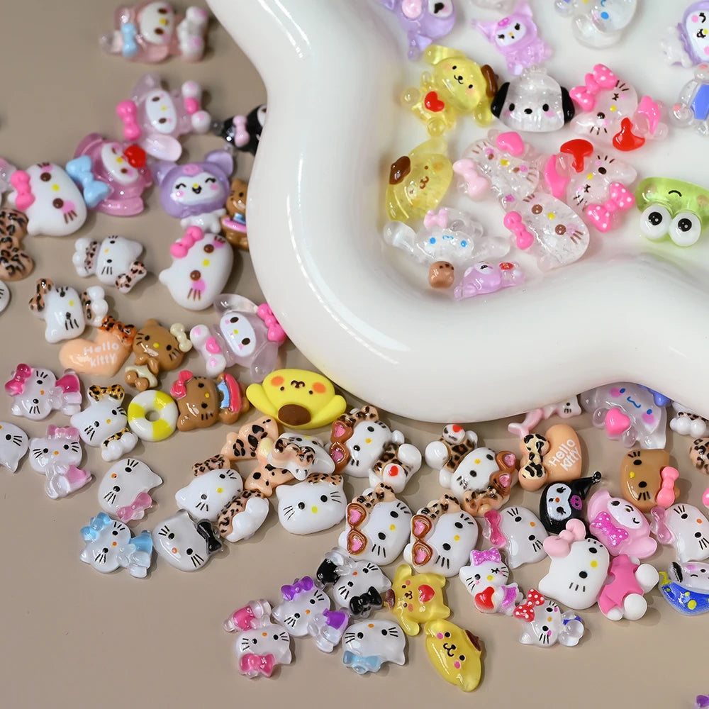 Collection of small decorative figurines, including Hello Kitty, on a beige surface.