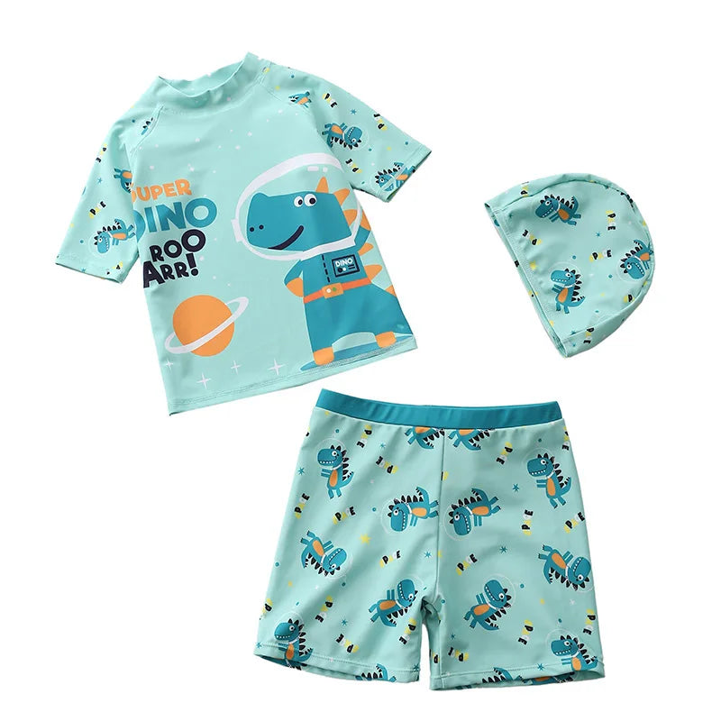 Children's dinosaur-themed swim set with shirt, shorts, and hat on a white background