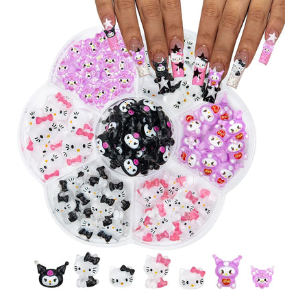 Set of nail art decorations in a tray with a hand displaying nails with designs.