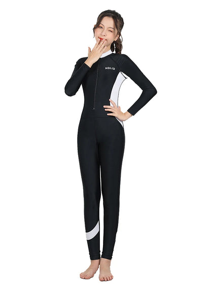 Person wearing a black wetsuit with a white stripe on a white background