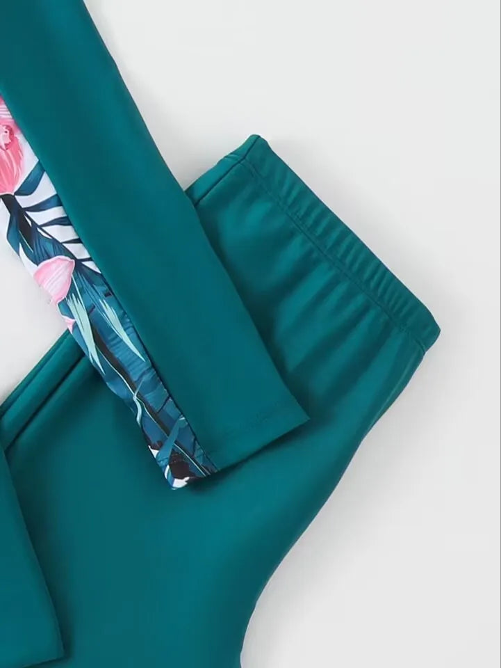 Teal shorts with floral pattern on a white background