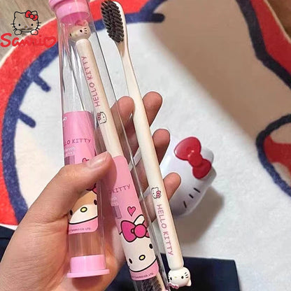 Hello Kitty toothbrush and case held by a hand with a colorful background