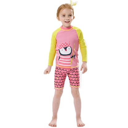 Child wearing a pink and yellow swimsuit with a cartoon design on a white background