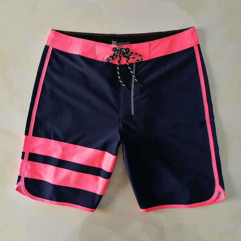 Black and pink striped shorts on a light background