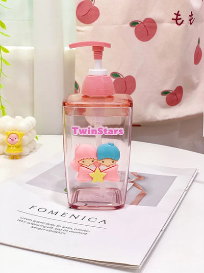 Pink cartoon-themed water bottle with a cherry design on a magazine