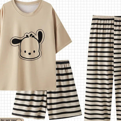 Beige t-shirt with cow design and black and white striped pants on a grid background, featuring the Pajama brand.