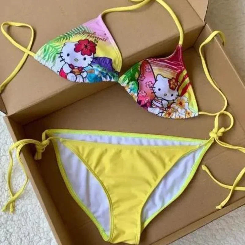 Colorful bikini set with Hello Kitty design on a cardboard box