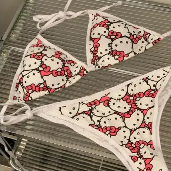 Hello Kitty patterned bikini set on a metal rack.