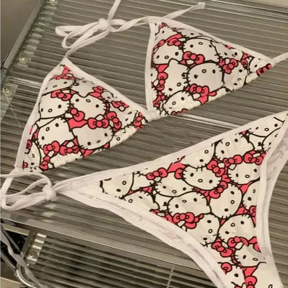 Hello Kitty patterned bikini set on a metal rack.