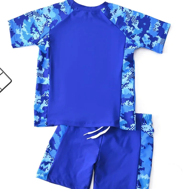 Blue camouflage children's swimsuit set on a white background