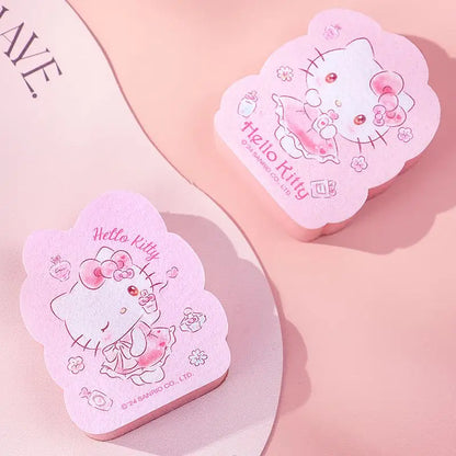 Two pink Hello Kitty kitcheen tool on a light pink background