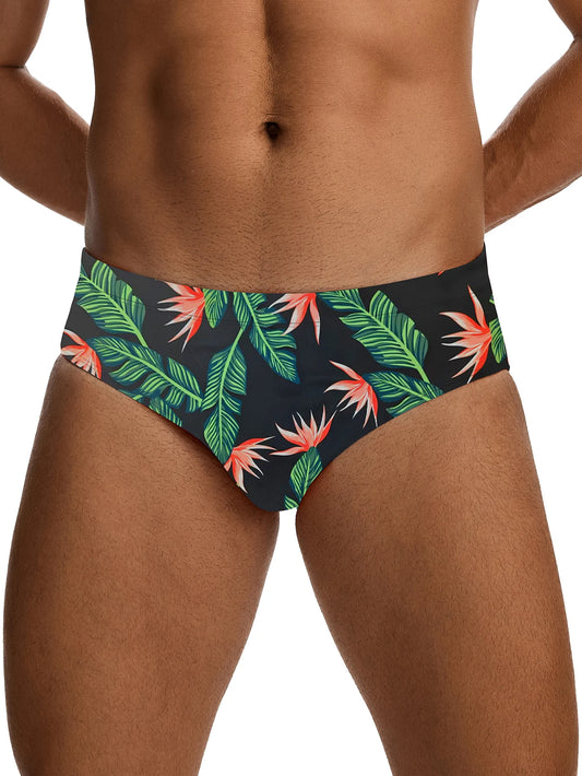 Tropical leaf patterned swim briefs on a white background