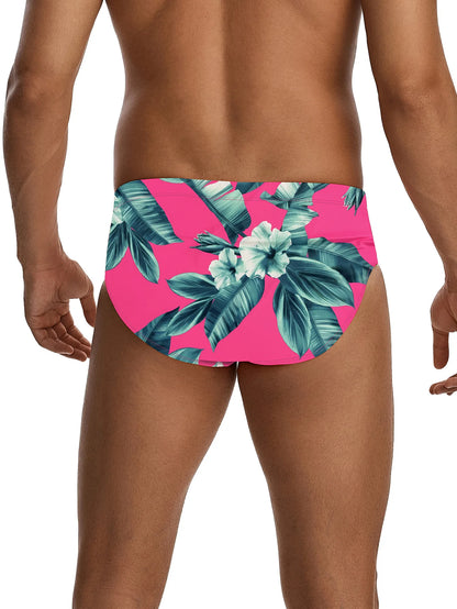 Tropical floral swim briefs on a pink background
