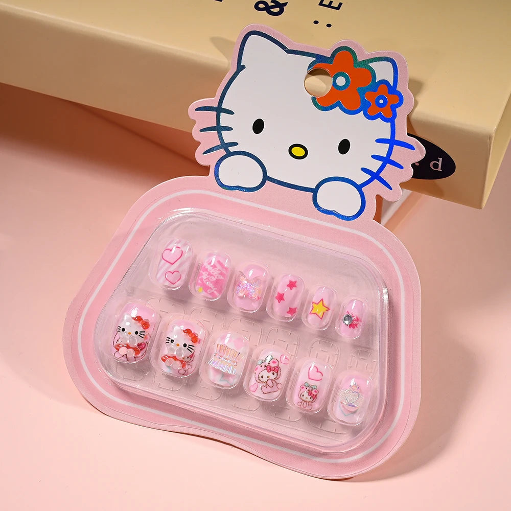 Set of cartoon-themed false nails in a clear case with a pink border, featuring a character on top.