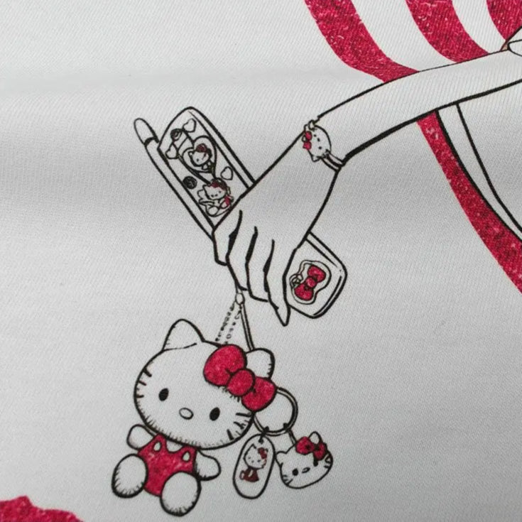 Embroidery of a Hello Kitty character with a dog on a white background