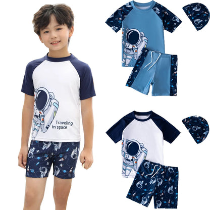 Child wearing a space-themed swimsuit with matching hat, surrounded by additional outfits on a white background.