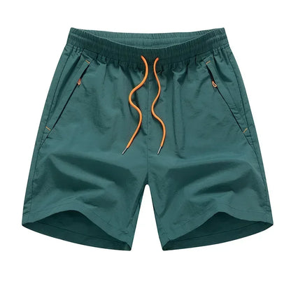 Teal shorts with orange drawstring on a white background
