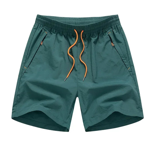 Teal shorts with orange drawstring on a white background