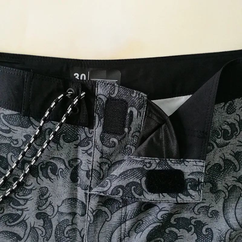 Close-up of a black and gray patterned suit with a brand label.