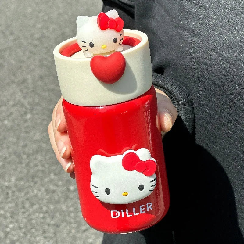 Red water bottle with Hello Kitty design held by a person