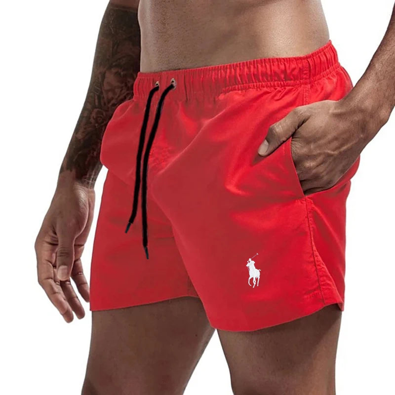 Red swim shorts with a brand logo on a white background