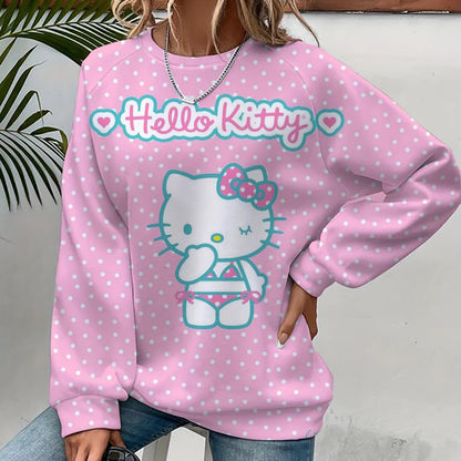 Pink 'Hello Kitty' sweatshirt with white polka dots worn by a person.