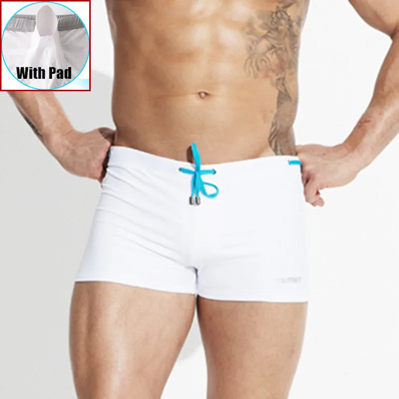 White boxer briefs with a blue drawstring on a plain background
