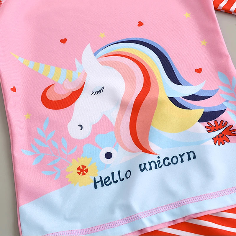 Children's towel with a colorful unicorn design and 'Hello unicorn' text on a pink background.