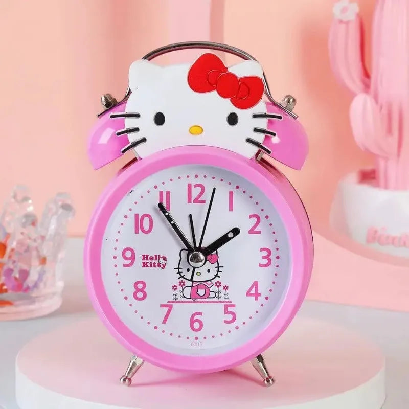 Pink alarm clock with Hello Kitty design on a pink background