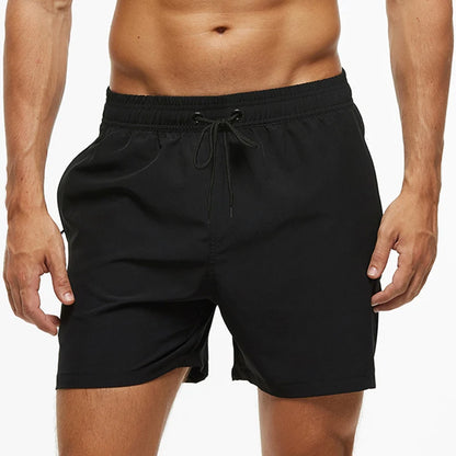 Black shorts worn by a person on a white background