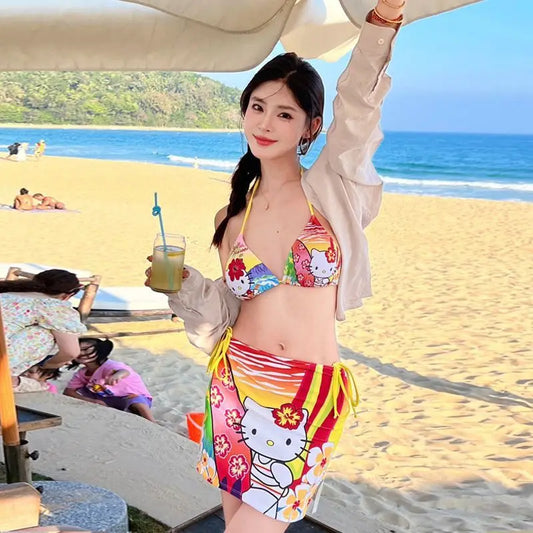 Woman in a colorful bikini with cartoon design on a beach