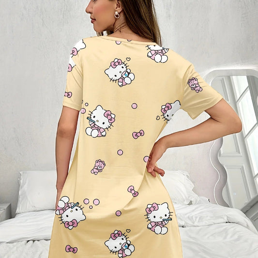 Woman wearing a yellow nightshirt with Hello Kitty prints in a bedroom setting