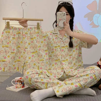 Person wearing a cartoon-themed pajama set in a casual setting.